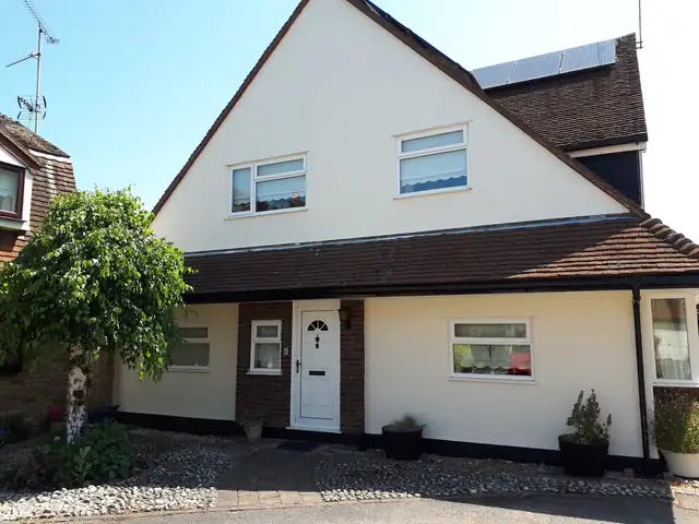 White rendered chalet bungalow
